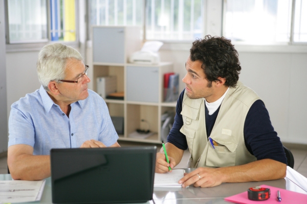business owner and staff discussing and computing propane needs