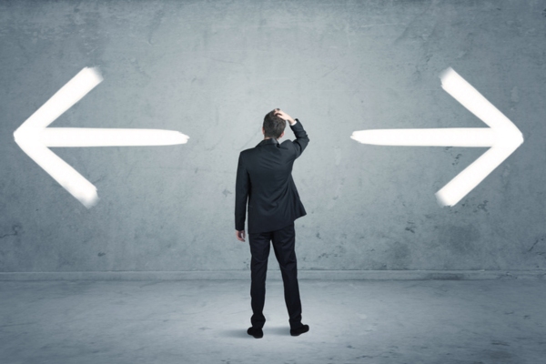businessman deciding between Whole-Facility vs. Partial Load Systems