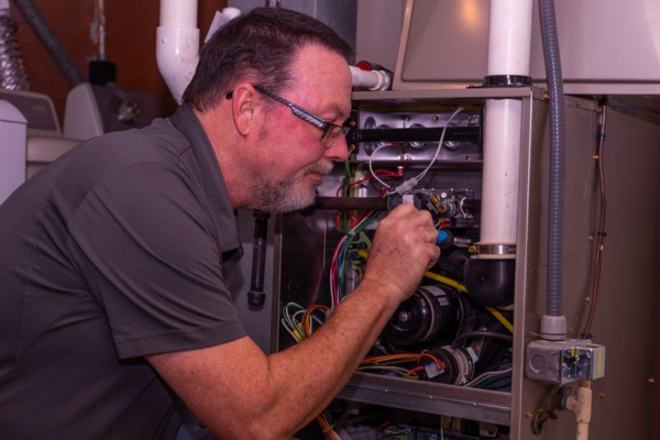 furnace maintenance by a professional HVAC technician