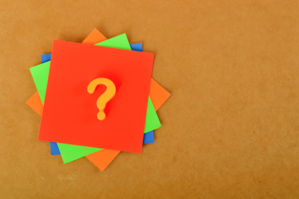 question mark on a stack of colored paper depicting FAQs about Commercial Propane Storage Safety