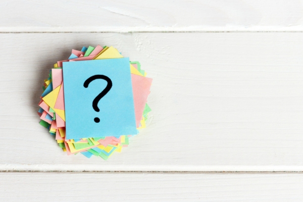 question mark on a stack of colored papers depicting FAQs about propane