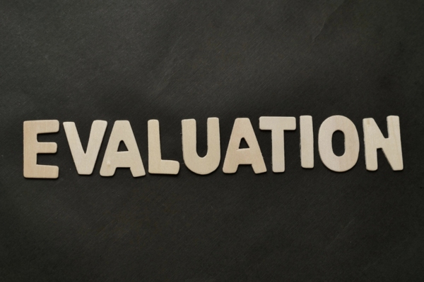 EVALUATION spelled using cutout letters depicting Propane Delivery Provider