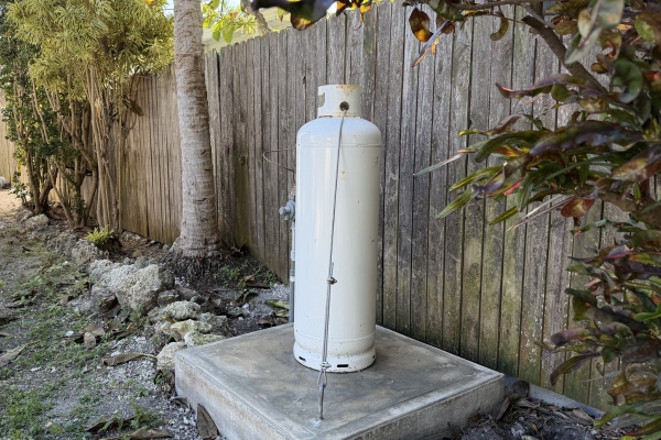 image of a tall propane tank on concrete