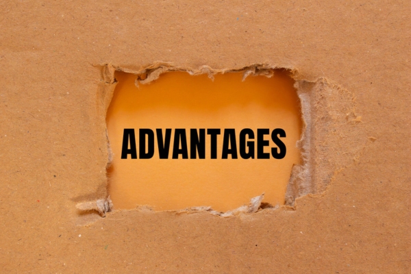 advantages written on paper revealed from a torn cardboard
