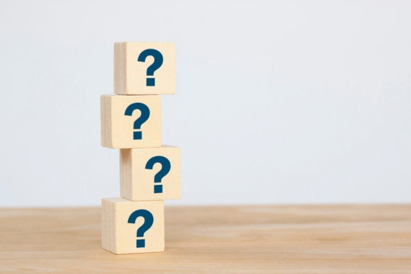 question marks on wooden cubes stacked on top of each other depicting Commercial Propane Fuel Efficiency FAQs